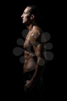 Muscular man in a black background