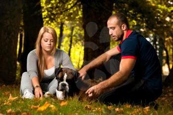 Pretty Young Family With Dogs
