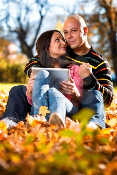 Happy Caucasian Couple With A Digital Tablet