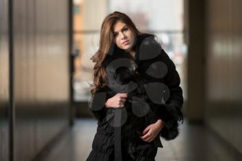 Glamour Fashion Model Wearing Black Winter Jacket