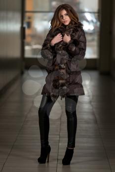 Young Woman Wearing Snow Jacket In Shopping Mall