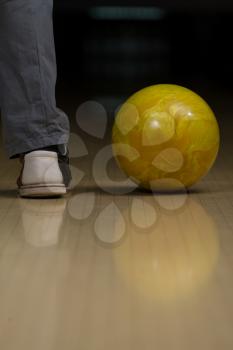 Bowling Ball Next To The Foot