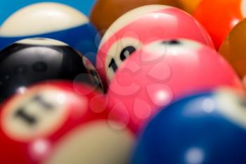 Close-Up Of Pool Balls On Blue Pool Table