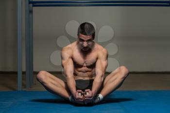 Athletic Man Stretches