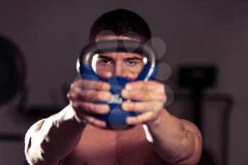 Athletic Man Workout With Kettle Bell
