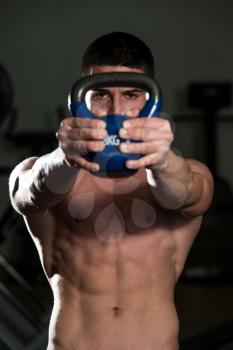 Muscular Man Exercise With KettleBell