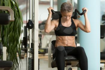 Attractive Woman Athlete Performing Exercise For Abdominal Muscles