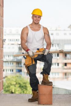 Construction Worker Relaxing The Fresh Air During Work