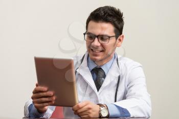 Young Doctor Working At His Computer