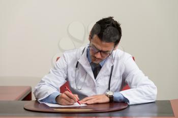 Doctor Writing A Letter - Notes Or Signing A Document Or Agreement