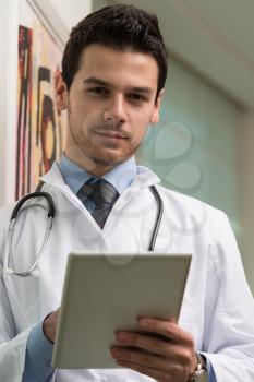 Handsome Doctor Looking At His Computer Monitor In His Office