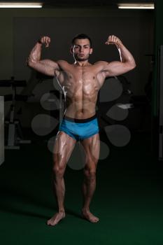 Body Builder Performing Front Double Biceps Poses