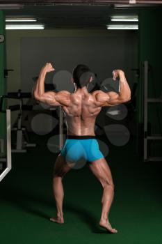 Body Builder Performing Rear Double Biceps Poses