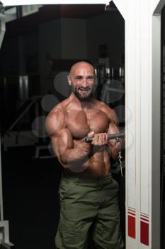 Mature Bodybuilder Exercise In The Gym - He Is Performing Two Arm Biceps Push Up