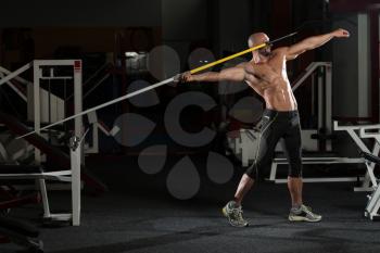 Mature Male Athlete Practicing To Throw A Javelin