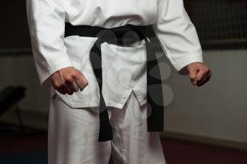 Man In A White Kimono And Belt For Martial Arts