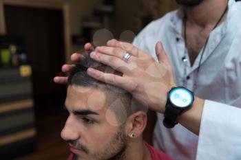 Hairdresser Preparing Young Man After A New Haircut