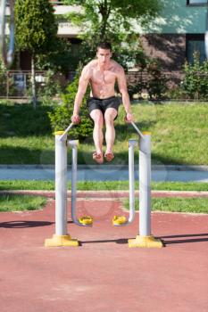 Handsome Muscular Young Man Workout In The Park