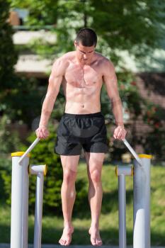 Handsome Muscular Young Man Workout In The Park