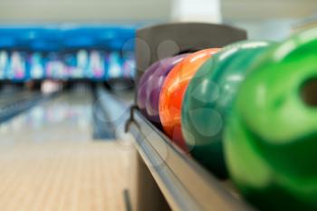 Rack Of Colorful Balls At A Bowling Alley