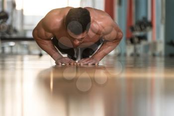 Young Adult Athlete Doing Push Ups As Part Of Bodybuilding Training