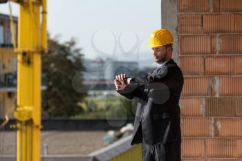 Businessman Looking At The Time On His Wrist Watch 