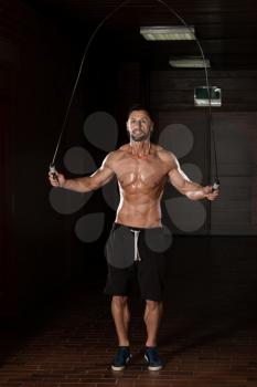 Handsome Muscular Man Exercising Jumping Rope - Cardio Time