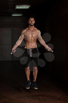 Handsome Muscular Man Exercising Jumping Rope - Cardio Time