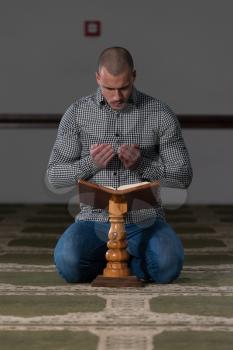 Muslim Man Is Reading The Koran