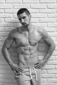 Athlete Muscular Bodybuilder Emotional Posing At The Wall