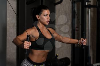 Young Woman Is Working On Her Chest With Cable Crossover In A Modern Gym