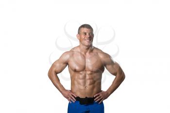 Young Muscular Man Posing In Studio Showing Abs - Isolated On White Background