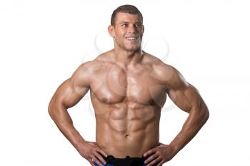 Young Muscular Man Posing In Studio Showing Abs - Isolated On White Background