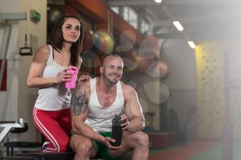 Young Couple Bodybuilder With Shaker Pills And Dope For Copy Space