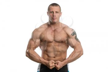 Muscular Young Man Posing In Studio - Isolated On White Background