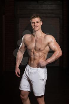 Portrait Of A Young Physically Fit Man Showing His Well Trained Body