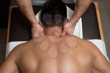 Masseur Doing Massage On Man Body In The Spa Salon