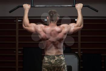 Adult Male Athlete Doing Pull Ups - Chin-Ups In The Gym - Best Exercise For Back