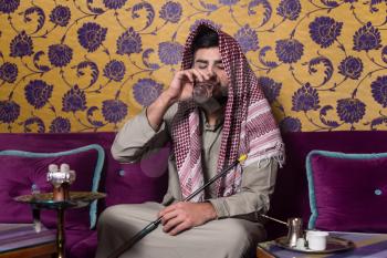 Muslim Man Smoking Shisha At Arabic Restaurant - Exhaling Smoke