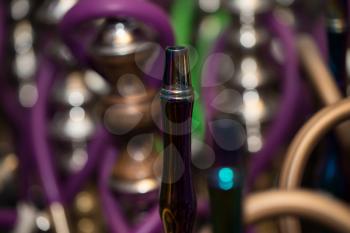 Close-up Of Several Hookahs Lined Up In A Cafe Bar