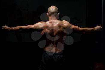 Muscular Man Praying - Spiritual Concentration Concept - Back View