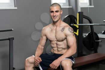 Good Looking And Attractive Young Man With Muscular Body Relaxing In Gym