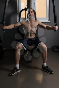 Butterfly Exercise Machine - Young Bodybuilder Doing Heavy Weight Exercise For Chest In The Gym