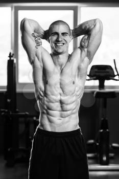 Portrait Of A Young Physically Fit Man Showing His Well Trained Body - Muscular Athletic Bodybuilder Fitness Model Posing After Exercises