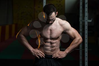 Portrait Of A Young Fit Man Showing His Well Trained Body - Muscular Athletic Bodybuilder Fitness Model Posing After Exercises