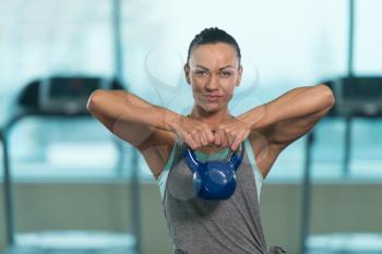 Young Woman Working With Kettle Bell In A Gym - Kettle-bell Exercise