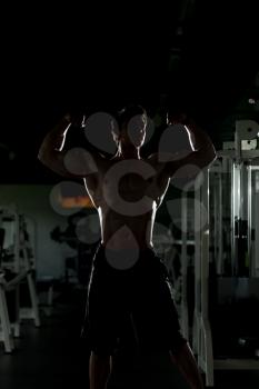 Bodybuilder Posing Silhouette In Different Poses Demonstrating Their Muscles - Male Showing Muscles Straining - Beautiful Muscular Body Athlete