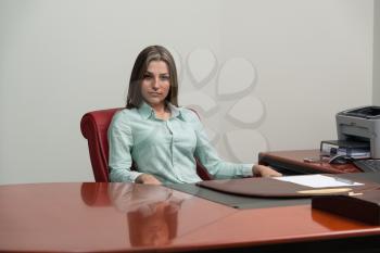 Portrait Of Young Beautiful Business Woman Relaxing At Office - Successful Businesswoman At Work