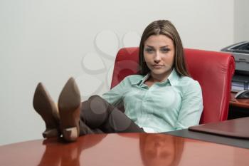 Business Woman Relaxing While Sitting On An Office Chair - Successful Businesswoman At Work