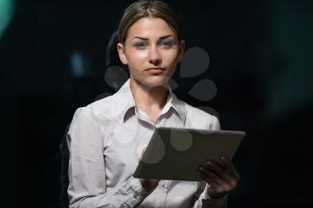 Portrait Of A Young Business Woman Using A Touchpad In The Office - Businesswoman Working Online